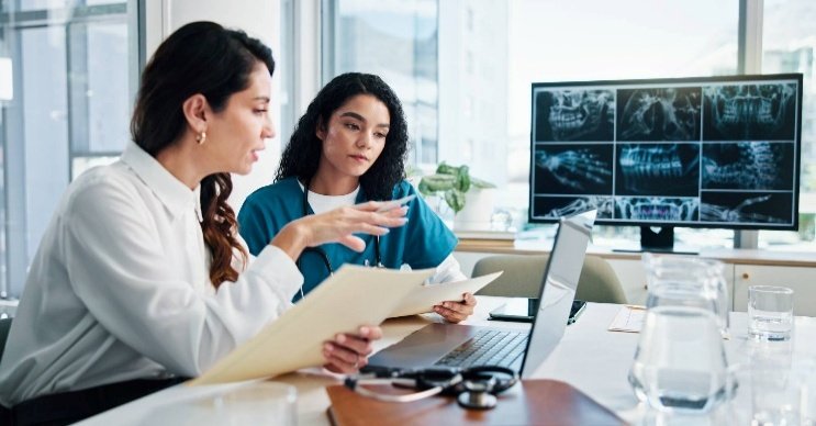 Healthcare professionals reviewing research together